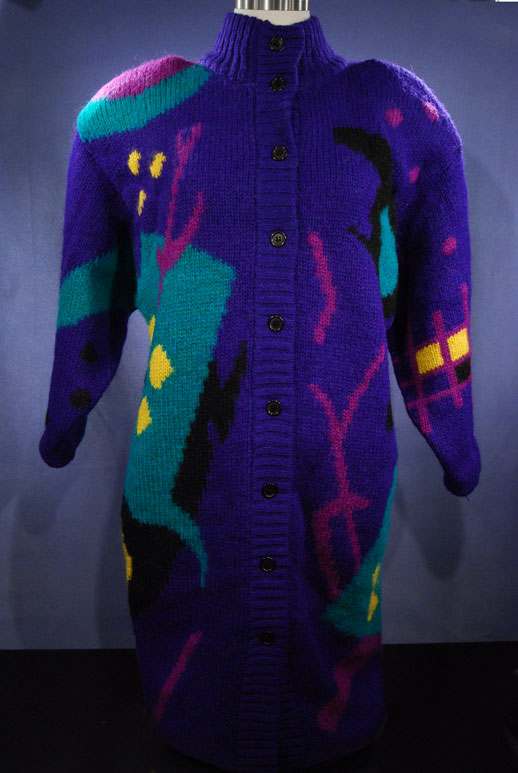 Woman's brightly colored wool sweater-coat with desert motif and front buttons