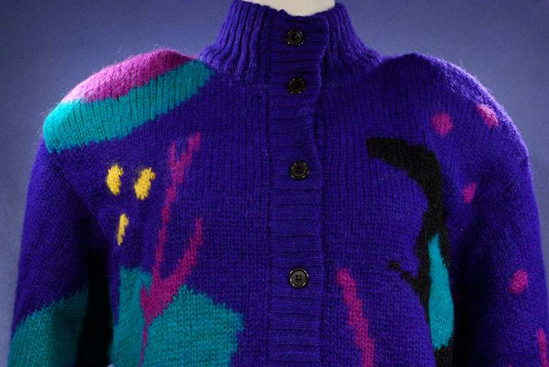 Woman's brightly colored wool sweater-coat with desert motif and button-up front