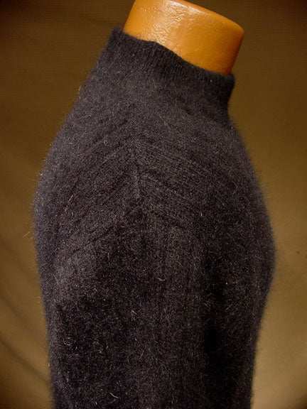 Woman's black angora crewneck sweater with vertical ribbing by Rafaella, size medium