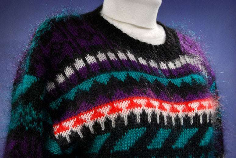 Woman's black multi-color striped mohair crewneck sweater with vibrant patterns