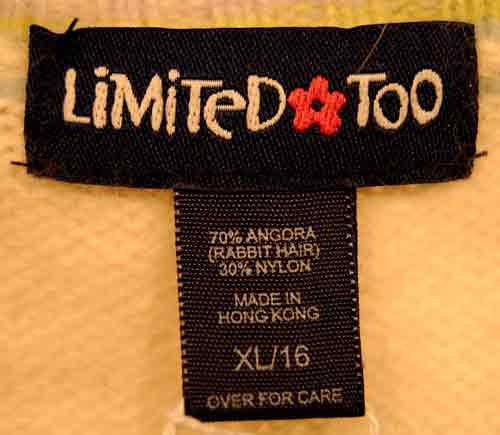 Girl's ivory angora sweater vest with pastel trim by Limited Too, size 16 label close-up