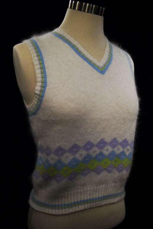 Girl's ivory angora sweater vest with pastel stripe trim and diamond pattern