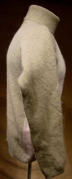Woman's tan angora-lambswool turtleneck sweater with argyle design, side view
