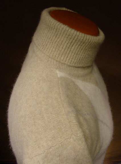 Woman's tan argyle angora lambswool turtleneck sweater with front diamond pattern