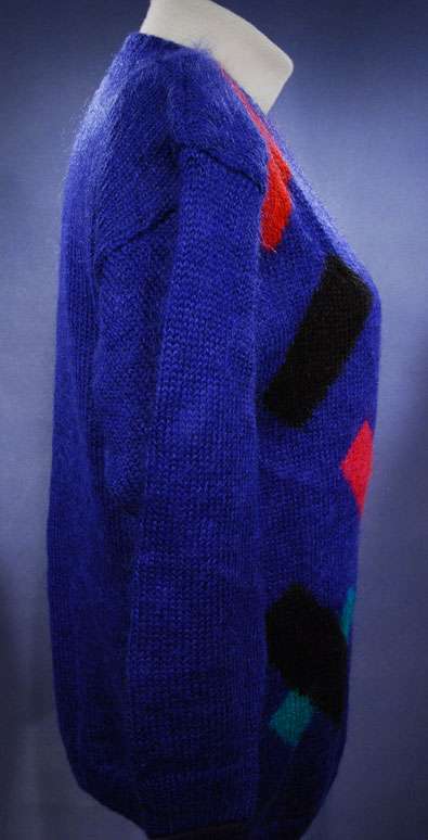 Woman's colorful deep V-neck jewel-tone geometric pullover sweater by Nell Flowers in small size