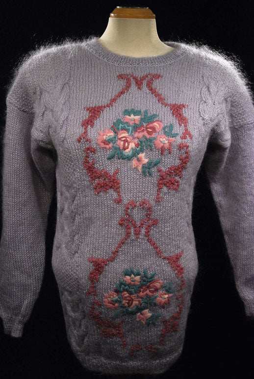 Woman's lavender mohair crewneck sweater with floral pattern and cable knit details