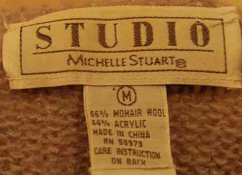 Label showing Studio Michelle Stuart lavender mohair and acrylic blend sweater size medium