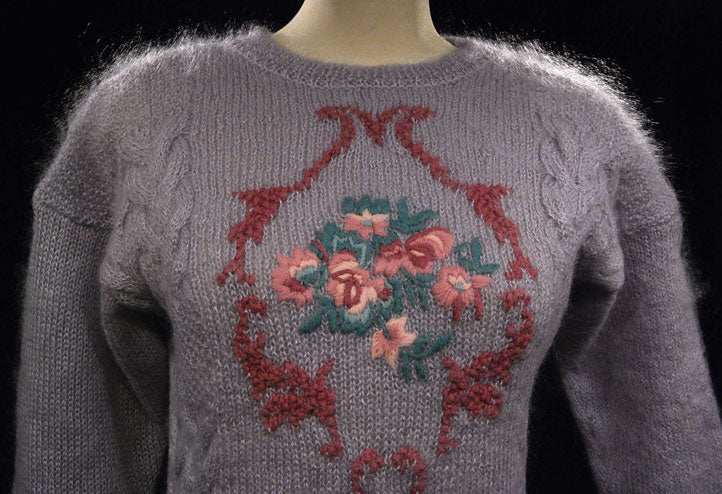 Woman's lavender mohair crewneck sweater with floral pattern on front