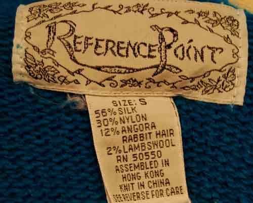 Close-up of Reference Point label on royal-blue silk-angora blend cowlneck sweater, size small