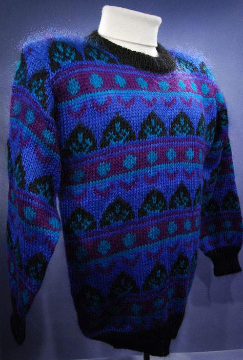 Woman's blue multi-colored retro mohair crewneck sweater with black trim by Gallagher
