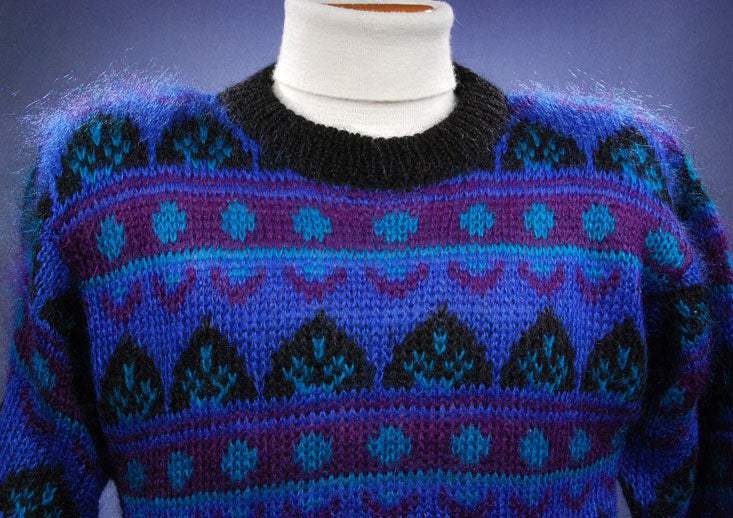 Woman's blue multi-colored retro mohair crewneck sweater with black trim by Gallagher
