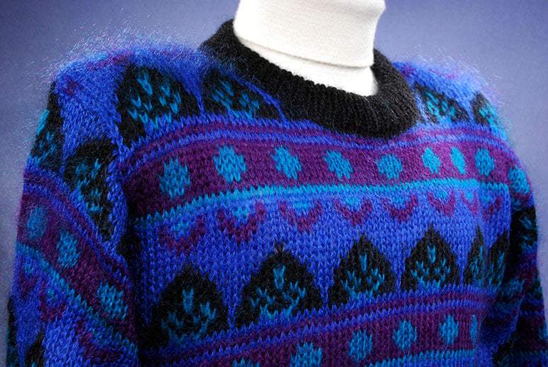 Woman's blue multi-colored retro crewneck mohair sweater with black trim by Gallagher in medium size