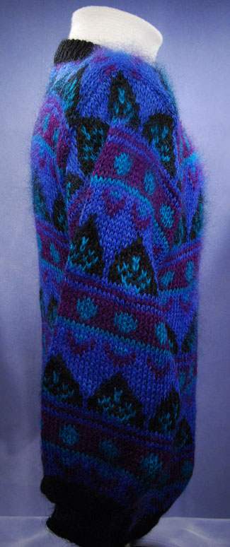 Woman's blue multi-colored retro crewneck mohair sweater with black trim by Gallagher in medium-large size
