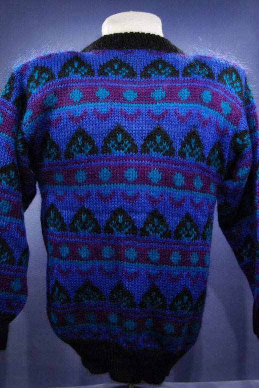 Woman's blue multi-colored retro crewneck mohair sweater with black trim by Gallagher in medium-large size