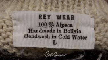 Unisex grey alpaca cardigan sweater with white trim and blue black yoke design by Rey Wear