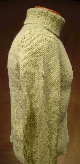 Woman's pale-green wool-acrylic turtleneck sweater by Old Navy in X-Small/Small size displayed on a mannequin against a brown background