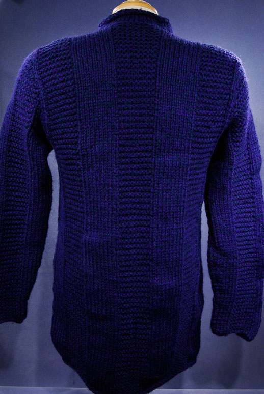 Woman's dark-blue hand-knit wool-acrylic rollneck sweater back view