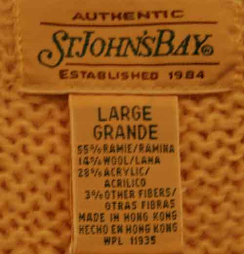 Close-up of St. John's Bay large size mohair cardigan label showing fabric content and care details