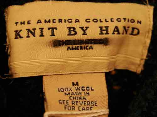 Woman's emerald-green 100% wool mock-turtleneck sweater label by Knit By Hand