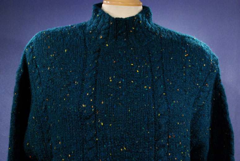 Woman's emerald-green 100% wool mock-turtleneck sweater with textured knit pattern