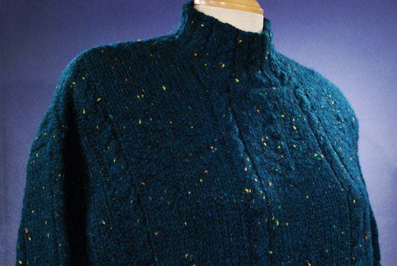 Woman's emerald-green 100% wool mock-turtleneck sweater with speckled knit design