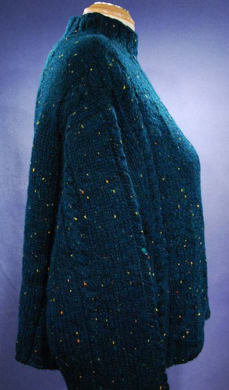 Woman's emerald-green 100% wool mock-turtleneck sweater by Knit By Hand in medium size