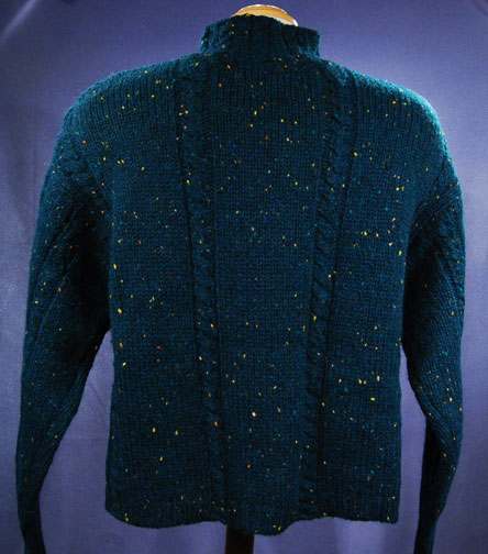 Woman's emerald-green 100% wool mock-turtleneck sweater with textured knit pattern