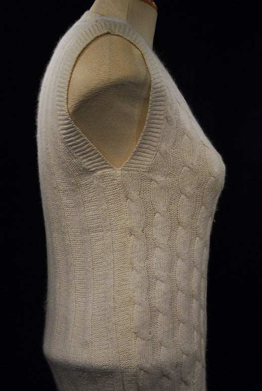 Woman's white silk-cotton-angora cable-knit sweater vest on mannequin side view