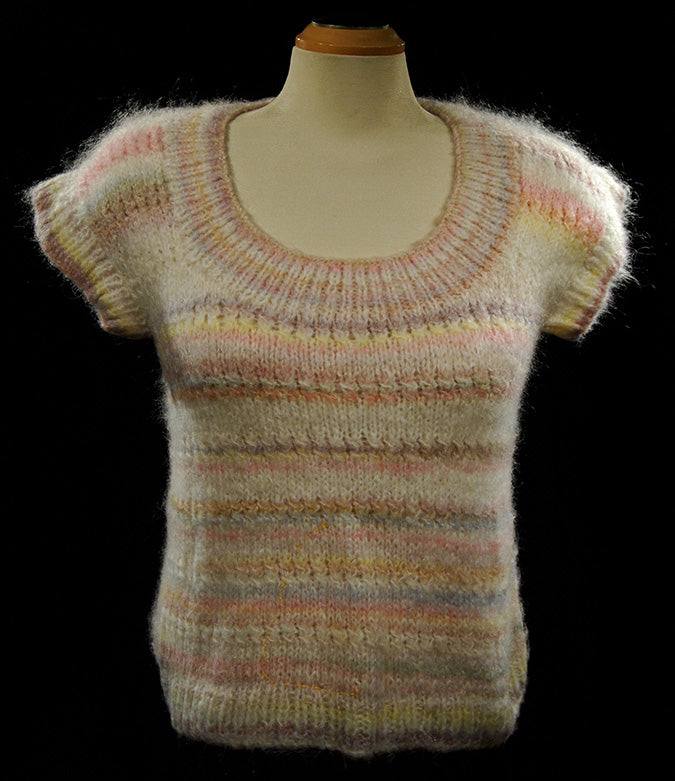 Woman's or girl's pastel colored sleeveless sweater vest with round neck in soft knit for spring and summer
