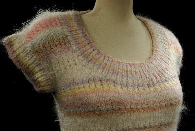 Hand-knit round-neck sleeveless sweater vest in white with soft pastel horizontal stripes for women or girls spring and summer wear