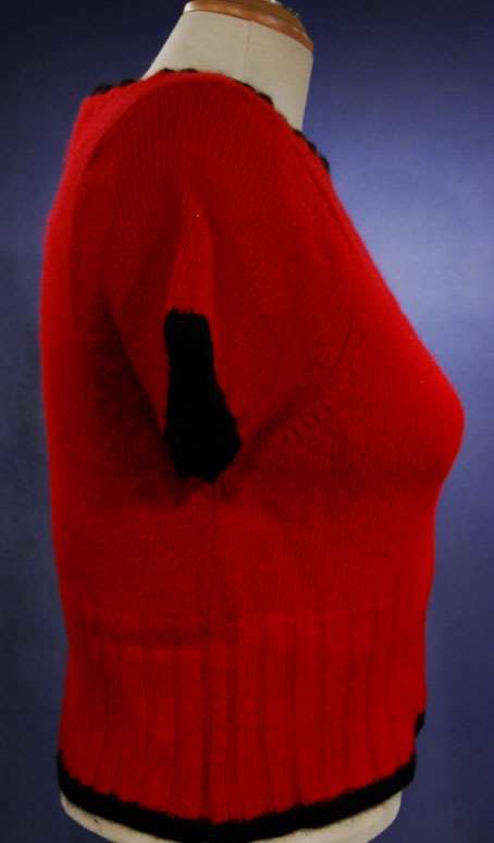 Teen girl's red short-sleeved angora sweater with black trim by The Limited