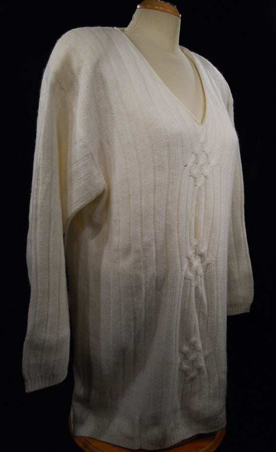 Plus-sized white angora V-neck sweater by New York Studio on mannequin