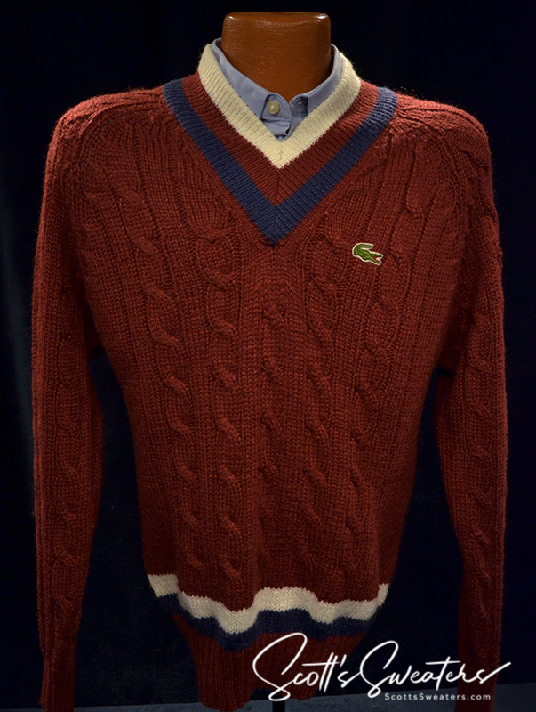 Men's classic retro burgundy Izod cable knit tennis sweater with blue and ivory striped V-neck collar and Lacoste logo