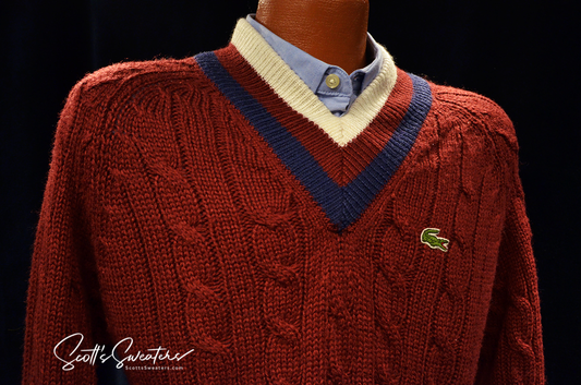 Men's classic retro burgundy Izod cable knit tennis sweater with blue and ivory striped neckband and Lacoste crocodile logo