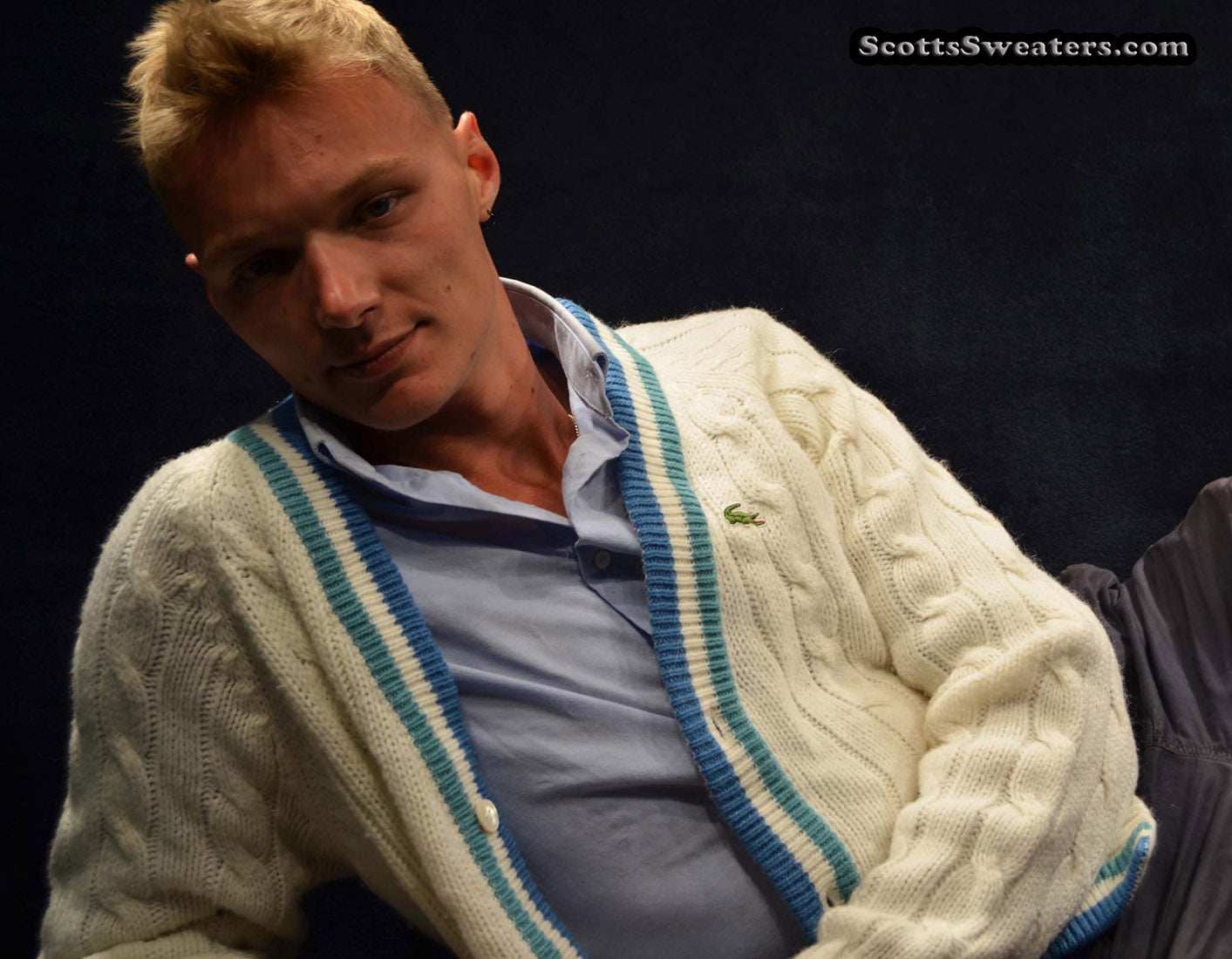 Men's classic retro Izod cardigan tennis sweater with blue striped trim and crocodile logo