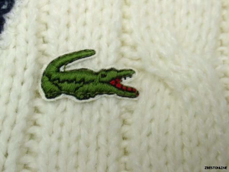Men's classic retro Izod tennis sweater with green crocodile logo on white knit fabric
