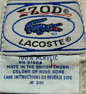 Original Izod Lacoste tennis sweater label with grey/red stripes and care instructions