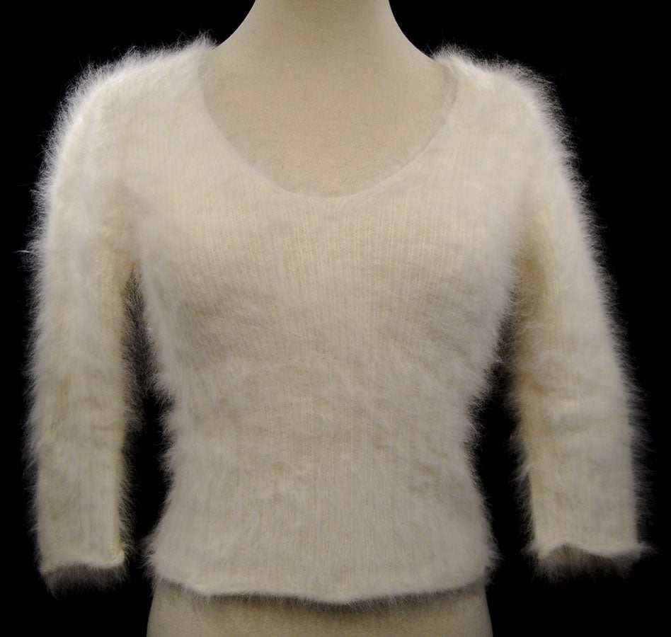 Woman's sexy cropped 3/4-sleeve angora ribbed V-neck sweater in soft beige