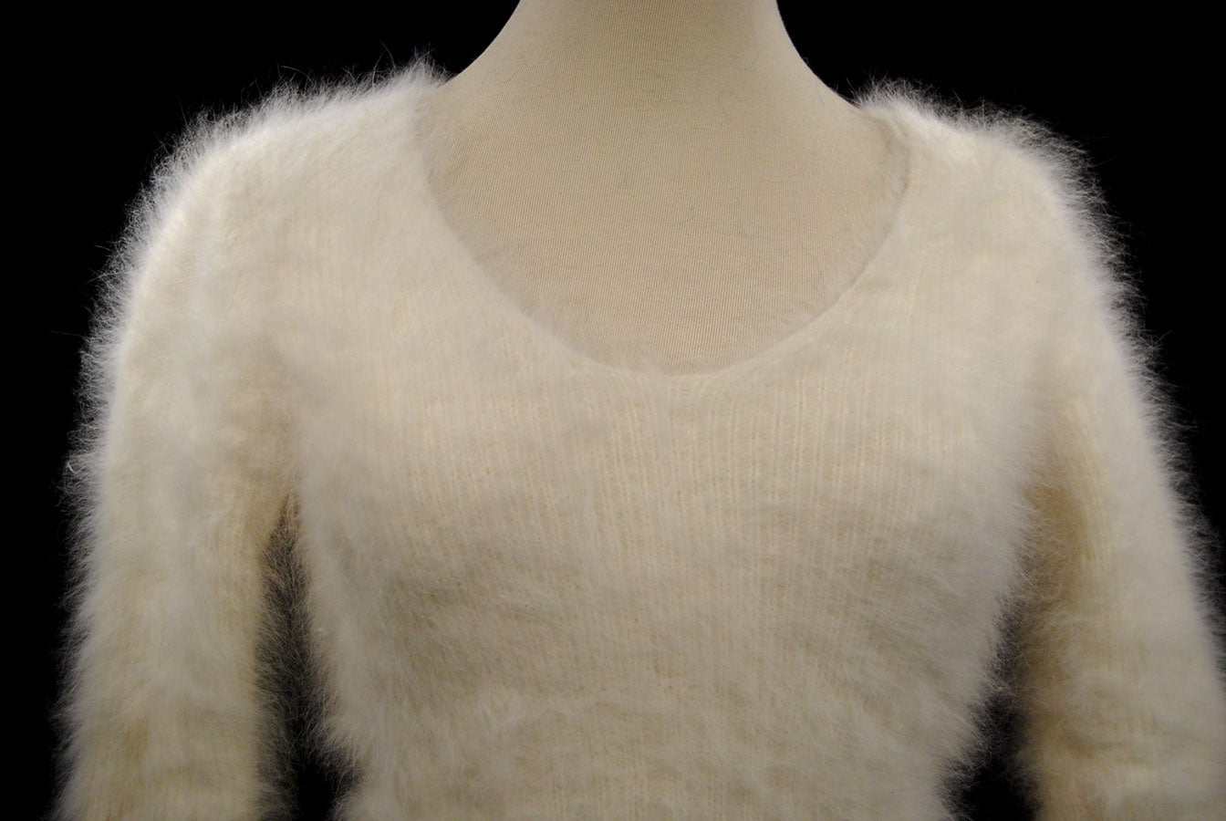 Woman's sexy cropped 3/4-sleeve angora sweater in soft ivory white