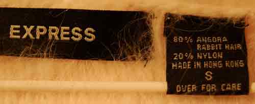 Express woman's sexy cropped 3/4-sleeve angora sweater label showing 80% angora blend and size small