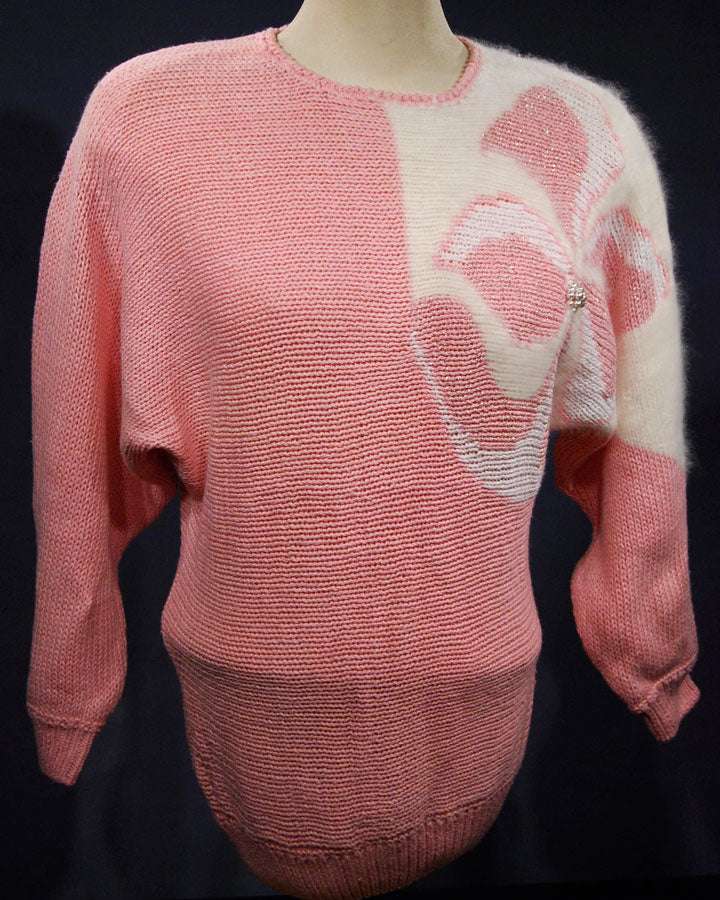 Woman's pink angora sweater with large white beaded design on left shoulder by David Brett, size 36