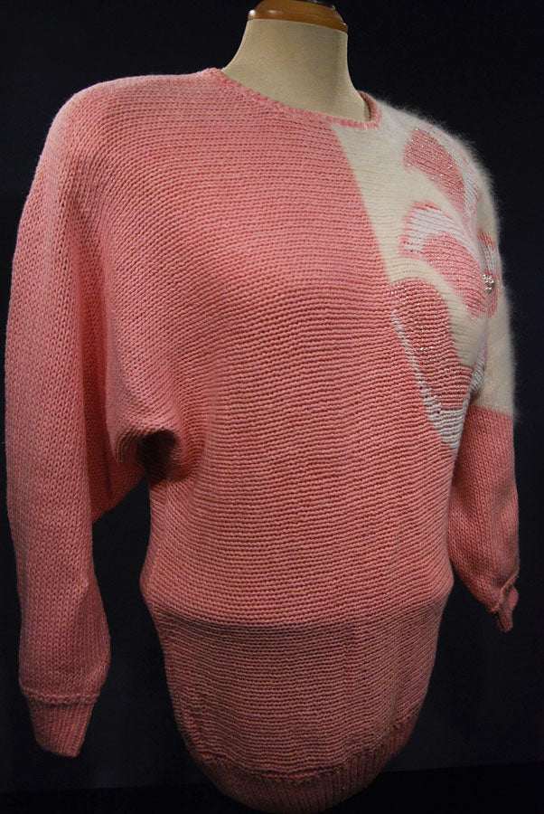 Woman's beaded-pink angora sweater with large white beaded design on left shoulder by David Brett, size 36