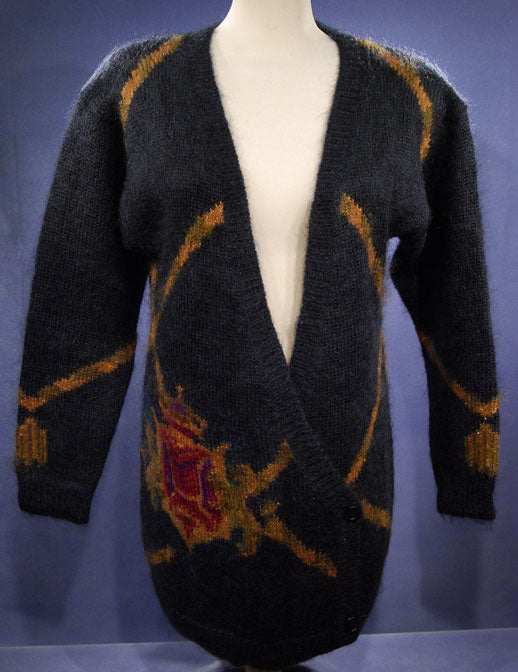 Woman's long black mohair cardigan sweater with metallic gold crest design by Linda Alland for Ellen Tracy