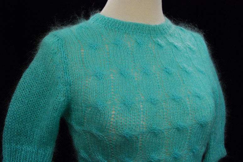 Girl's pale-green short-sleeve mohair crewneck sweater in bright aqua green on mannequin