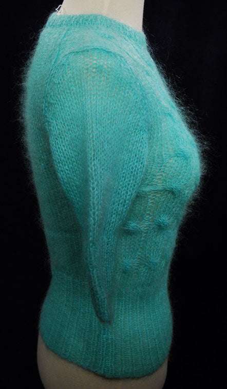 Girl's pale-green short-sleeve mohair sweater in bright aqua green summer-weight crewneck style