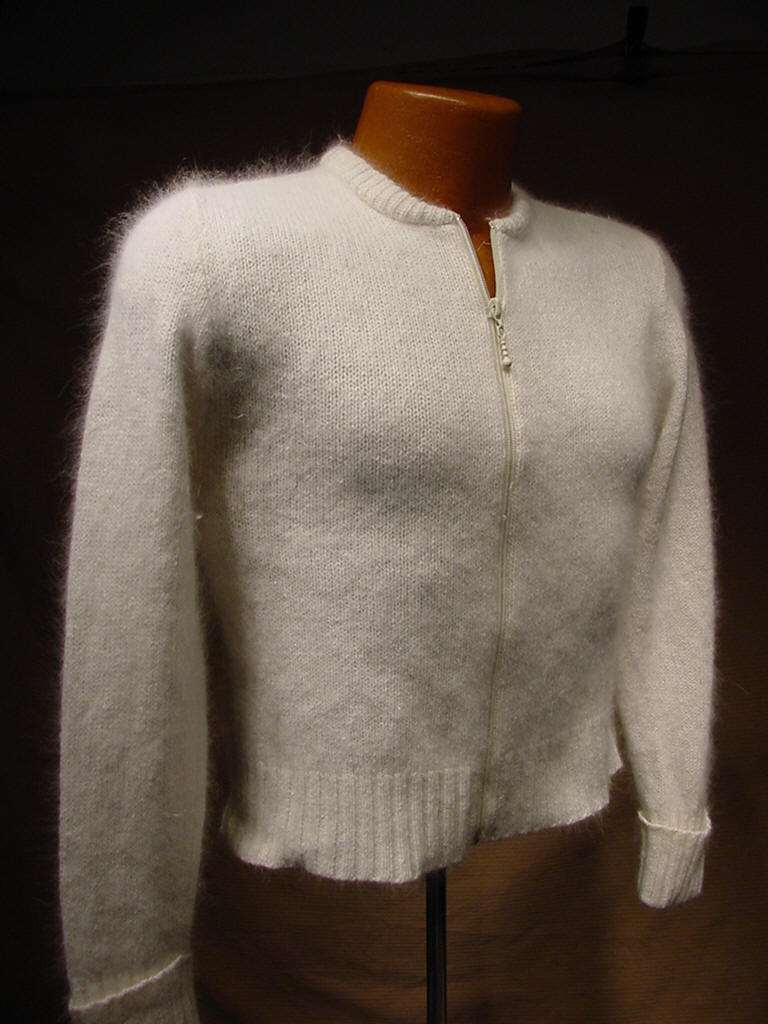 Teen girl's cropped zipper-front natural white silk-angora cardigan sweater on mannequin