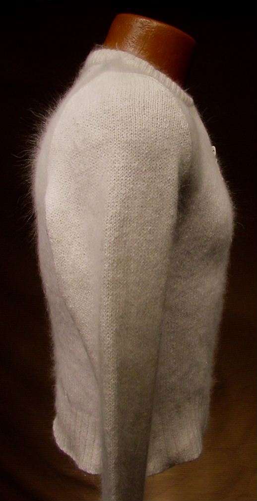 Teen girl's cropped zipper-front white silk-angora cardigan sweater side view