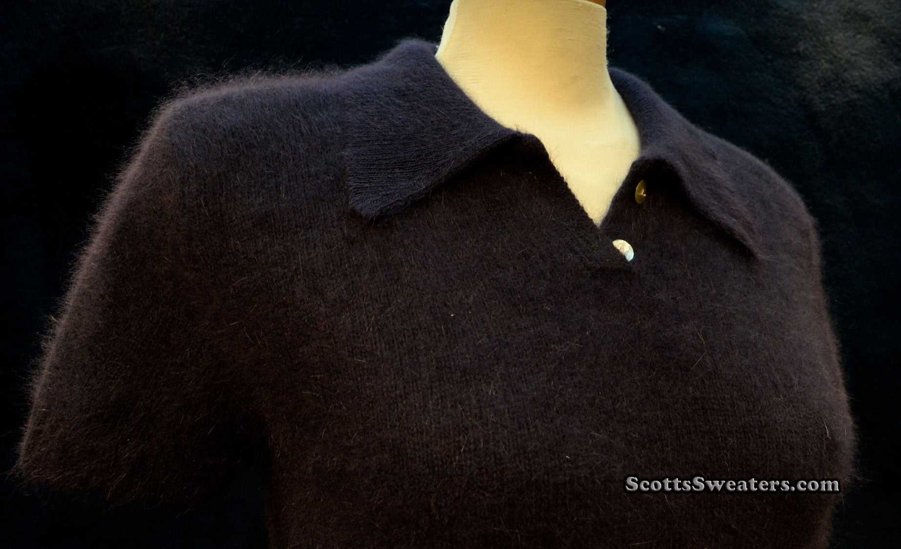 Woman's navy-blue short-sleeve angora polo-neck sweater by The Limited on mannequin