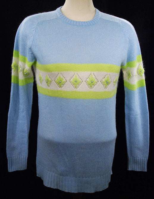 Girl's powder-blue angora crewneck sweater with white and lime green geometric design