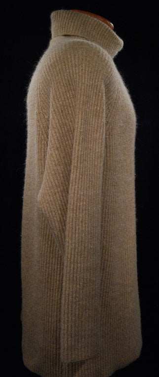 Woman's tan angora turtleneck sweater with ribbed lambswool design, medium size